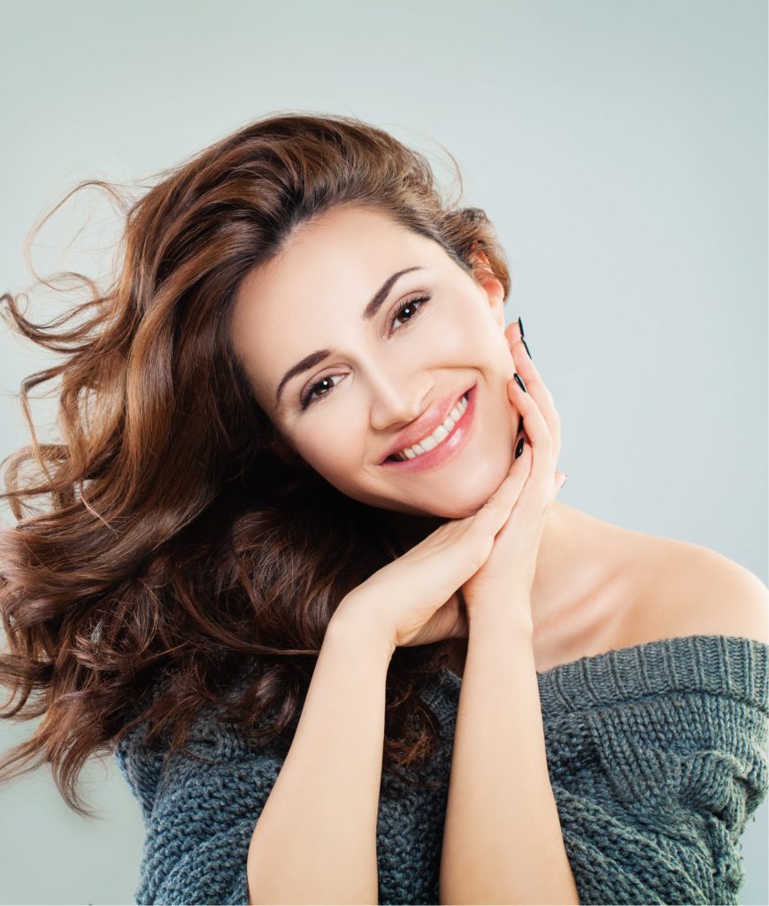 Smiling woman in a green sweater